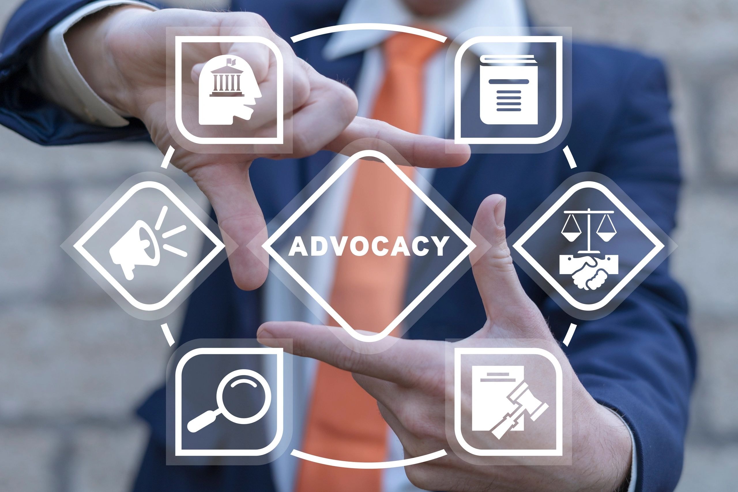A businessman in a suit framing a holographic advocacy diagram with icons for government, law, and public interest